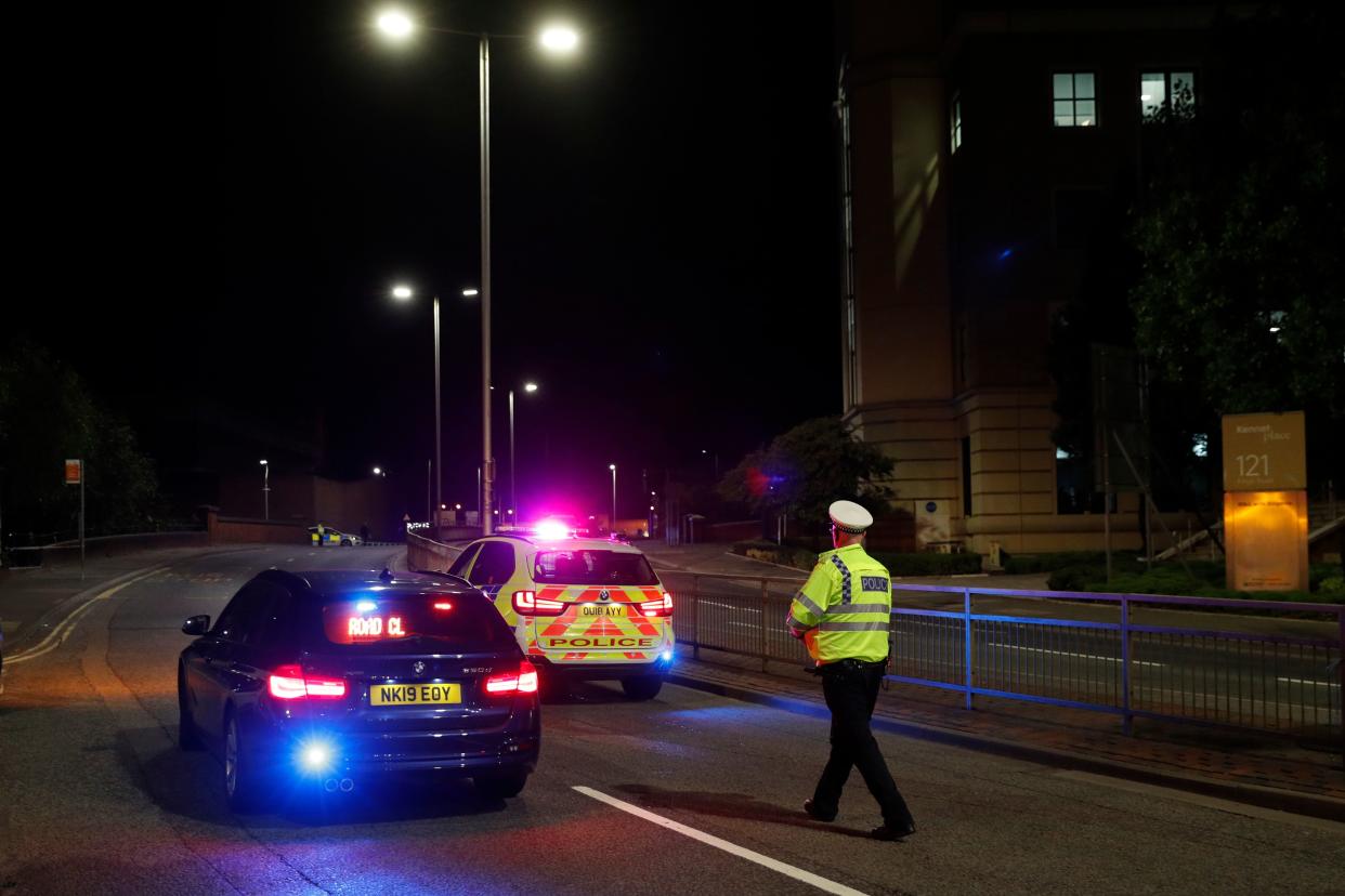 Police officers are seen at a police cordon in central Reading, west of London, on June 20, 2020 following a stabbing incident at Forbury Gardens park. - British police said Saturday they were investigating a "serious incident" in the southern English city of Reading, with reports suggesting multiple stabbings. British media said the stabbings occurred in a central park, requiring two air ambulances to be called in. (Photo by Adrian DENNIS / AFP) (Photo by ADRIAN DENNIS/AFP via Getty Images)