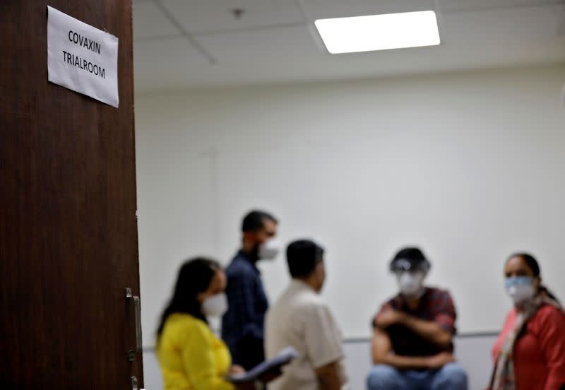 FILE PHOTO: Medics prepare to administer COVAXIN, an Indian government-backed experimental COVID-19 vaccine, to a health worker during its trials, in Ahmedabad