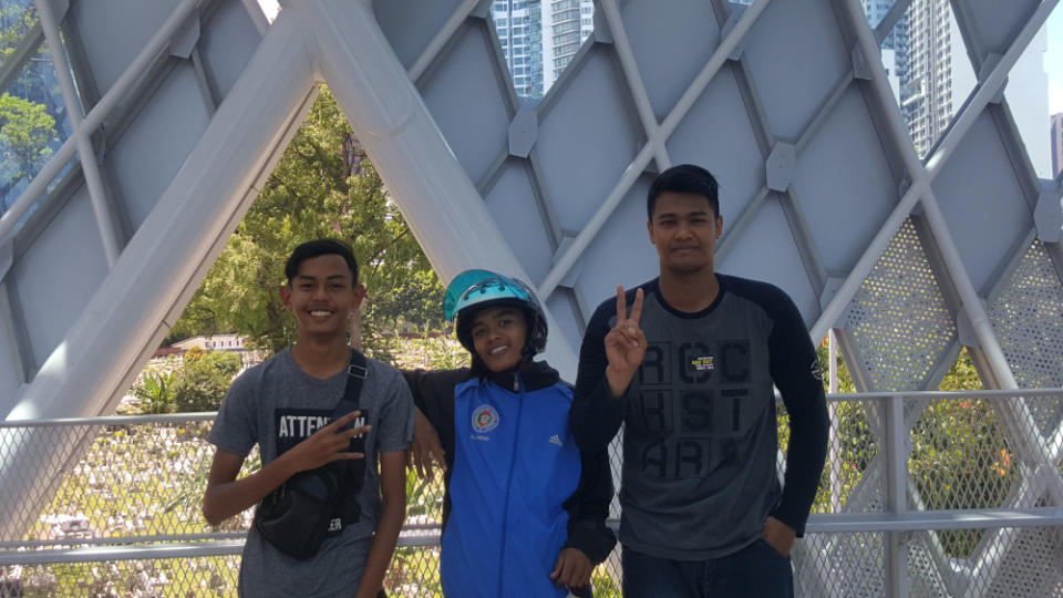 (From left) Muhd Iskandar Ismail, Muhd Zulizhan and Muhd Danial Aizat planned to come back again that night with their friends to take pictures. — Picture by R. Loheswar