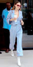 <p>No one rocks a pair of street-worthy PJs quite like Gigi. The 22-year-old model stepped out in N.Y.C. in a pair of pale blue pinstriped pajamas with red piping (shop a similar look <a rel="nofollow noopener" href="http://www.neimanmarcus.com/P-Jamas-Haberdashery-Long-Sleeve-Pajama-Set-Blue-White/prod197730137/p.prod?" target="_blank" data-ylk="slk:here;elm:context_link;itc:0;sec:content-canvas" class="link ">here</a>), which she wore with a red bra by Fleur du Mal, white go-go boots, and red-rimmed cat-eye sunglasses. Hadid, sans purse (or fanny pack!) carried only a venti Starbucks cup on her cosmopolitan stroll. </p>