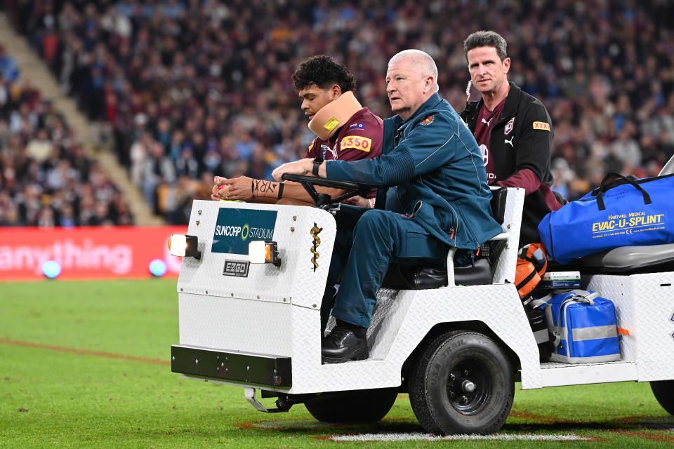 Selwyn Cobbo, pictured here leaving the field in a neck brace after being knocked out in State of Origin III.