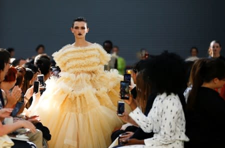 Models present creations during the Molly Goddard catwalk show during London Fashion Week in London