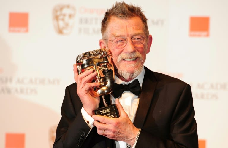 John Hurt poses with his award for outstanding British contribution at the BAFTA awards in February, 2012