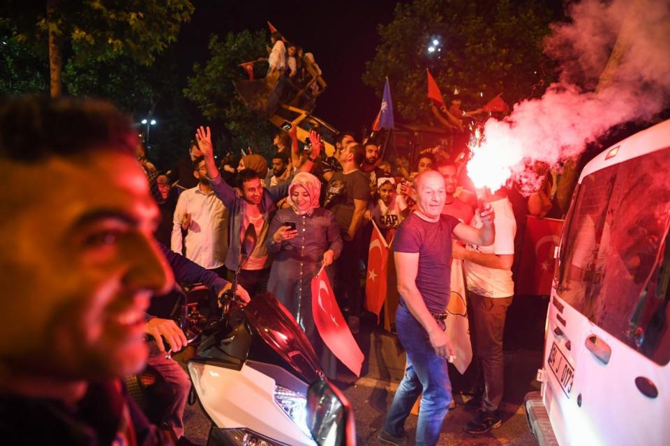 Tayyip Erdogan's supporters celebrate in the streets of Instanbul (Getty Images)