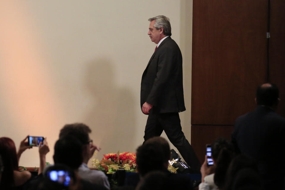 Journalists film on their cell phones as Argentina's President-elect Alberto Fernandez arrives for a press conference following a private meeting with Mexican President Andres Manuel Lopez Obrador, at the National Palace in Mexico City, Monday, Nov. 4, 2019.(AP Photo/Rebecca Blackwell)