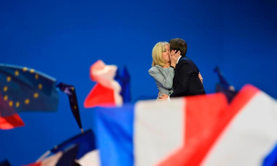 Emmanuel Macron kisses his wife Brigitte Trogneux on stage after the first round of the presidential election. 