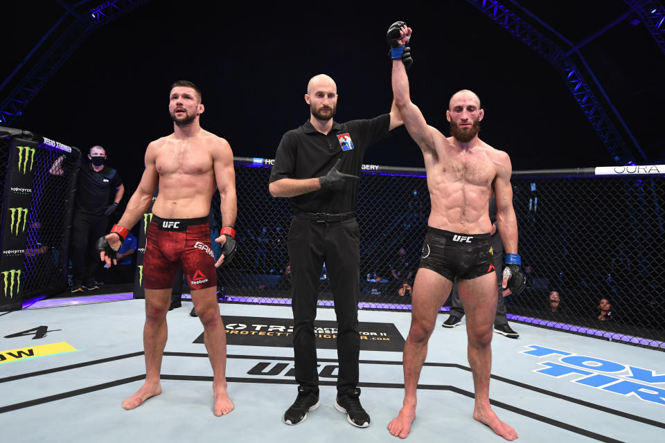 ABU DHABI, UNITED ARAB EMIRATES - OCTOBER 18:  (R-L) Guram Kutateladze of Georgia celebrates his victory over Mateusz Gamrot of Poland in their lightweight bout during the UFC Fight Night event inside Flash Forum on UFC Fight Island on October 18, 2020 in Abu Dhabi, United Arab Emirates. (Photo by Josh Hedges/Zuffa LLC via Getty Images)