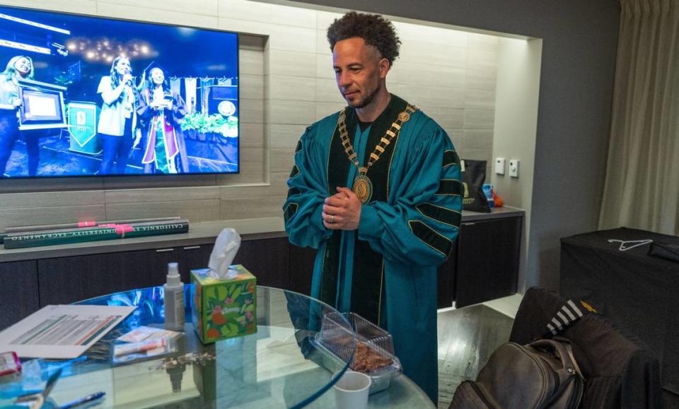 Sacramento State President Luke Wood takes a quiet moment before the commencement ceremony for the College of Letters at Golden 1 Center on Friday, May 17, 2024. Wood said that the ceremony is special to him because he could not afford to attend his CSUS graduation ceremony.