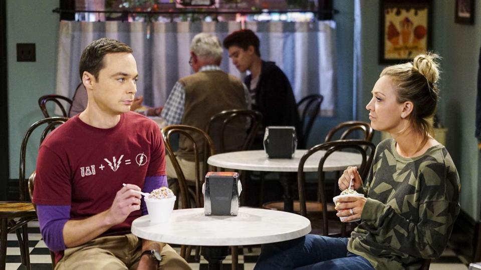 Jim Parsons and Kaley Cuoco sitting at a table