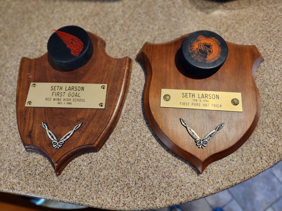 Plaques commemorate the first goal and first natural hat trick by Seth Larson during his sophomore season at Red Wing High School in Minnesota in 1995-96.