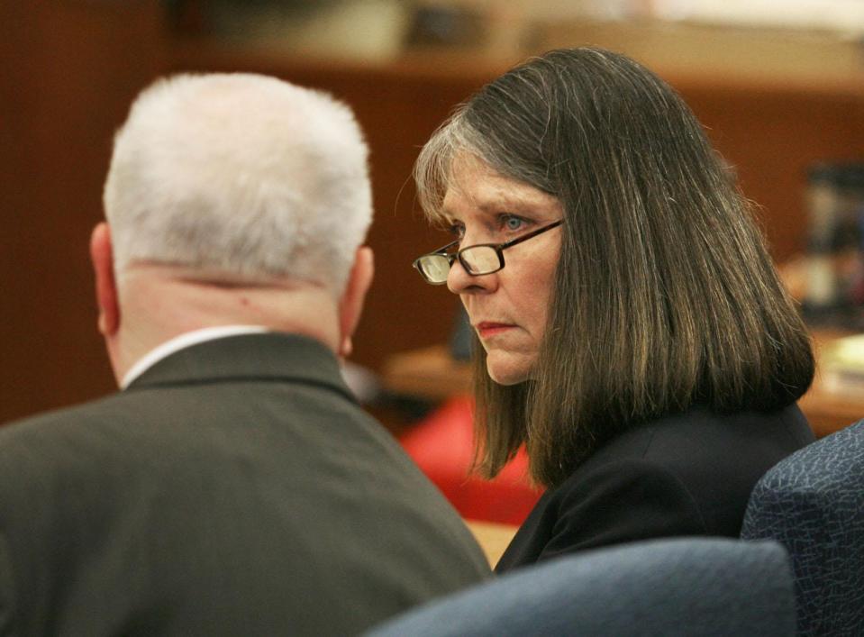 Dana L. Chandler, right, confers with her attorney Mark Bennett in 2012 during the third week of her trial on two counts of first-degree murder in the 2002 shoting deaths of her ex-husband and his fiancee.