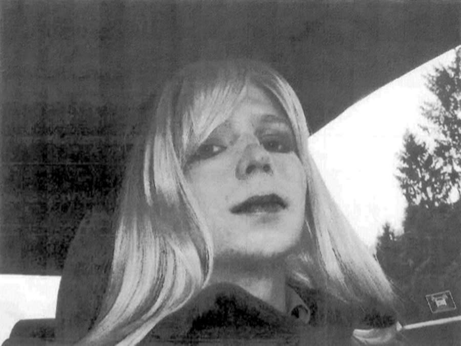 U.S. Army, Pfc. Bradley Manning poses for a photo wearing a wig and lipstick