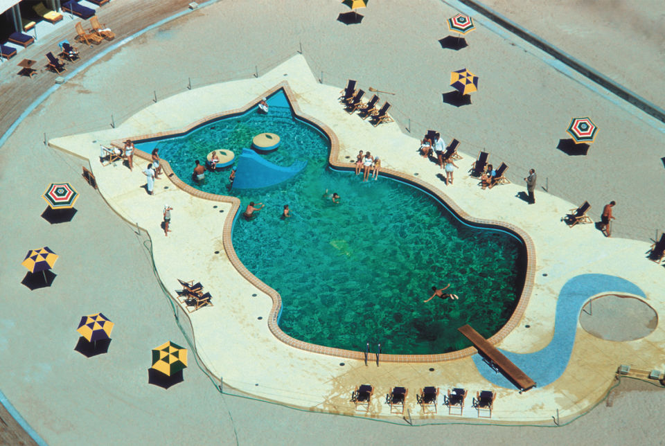 The Fontainebleau Miami Beach’s famous cat-shaped pool, captured by photographer Slim Aarons in 1955.