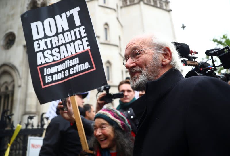 John Shipton, father of Julian Assange, walks outside the Royal Courts of Justice in London