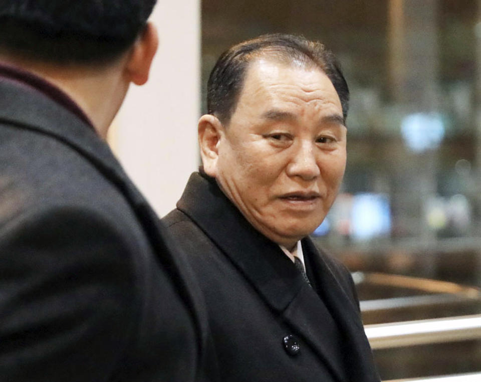 North Korean official Kim Yong Chol, right, prepares to leave the Beijing International Airport in Beijing Thursday, Jan. 17, 2019. Kim arrived in Beijing on Thursday, reportedly en route to the United States for talks ahead of a possible second summit between President Donald Trump and North Korean leader Kim Jong Un. (Kyodo News via AP)