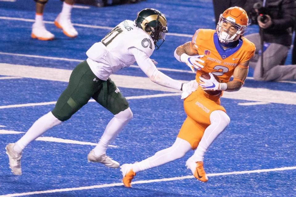 Boise State wide receiver Khalil Shakir catches a pass over Colorado State defensive back Tywan Francis during the 2020 game against Colorado State.