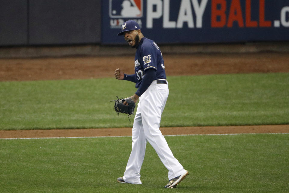 Milwaukee Brewers relief pitcher Jeremy Jeffress (32) reacts after a double play during the seventh inning of Game 2 of the National League Championship Series baseball game against the Los Angeles Dodgers Saturday, Oct. 13, 2018, in Milwaukee. (AP Photo/Charlie Riedel)