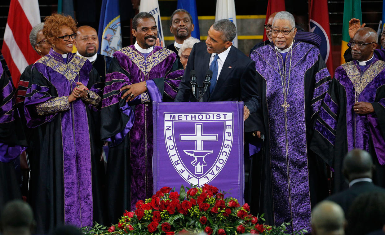 President Barack Obama leads mourners in singing the song 