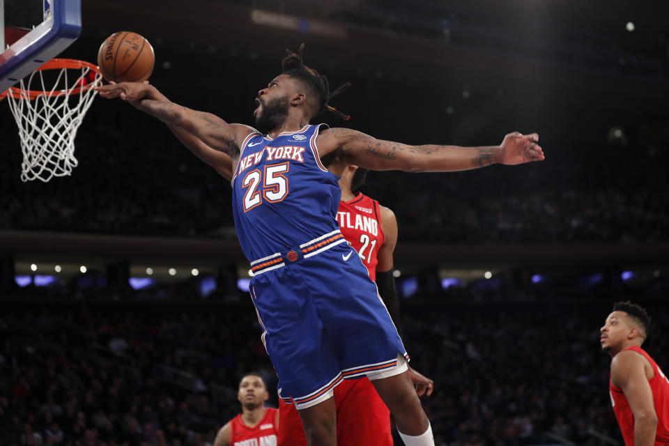 Portland Trail Blazers center Hassan Whiteside (21) interrupts a shot by New York Knicks guard Reggie Bullock (25) during the second half of an NBA basketball game in New York, Wednesday, Jan. 1, 2020. (AP Photo/Kathy Willens)
