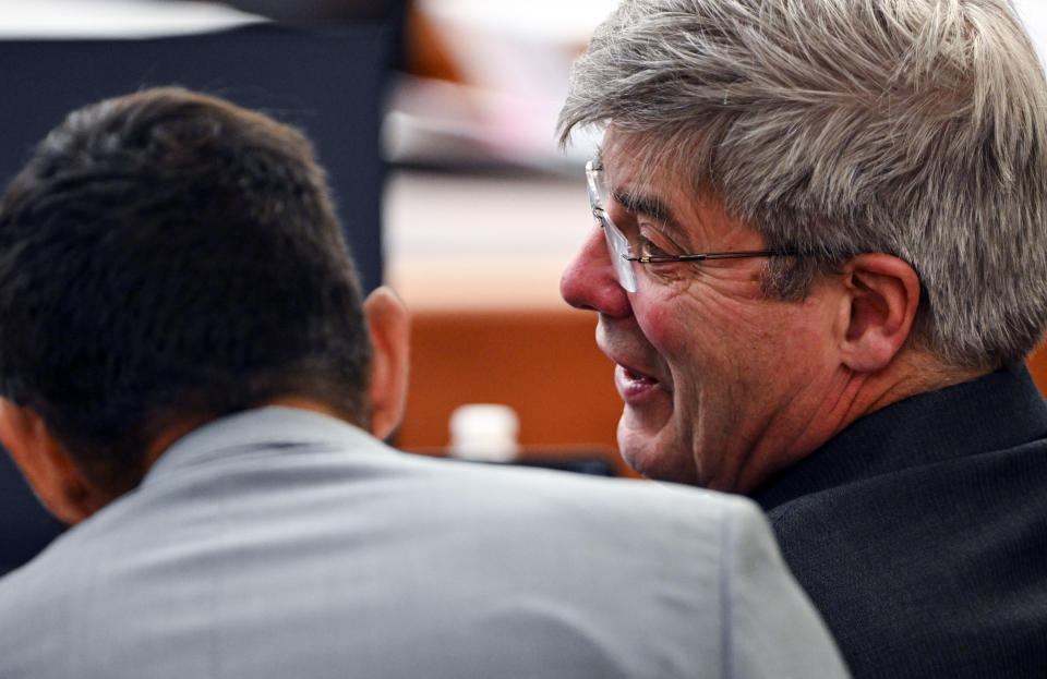 Christopher Burbank speaks with defense attorney Wayne Fricke during the trial of Tacoma Police Officers Christopher Burbank, Matthew Collins and Timothy Rankine in the killing of Manny Ellis at Pierce County Superior Court, Tuesday, Oct. 10, 2023, in Tacoma, Wash. (Brian Hayes/The News Tribune via AP, Pool)