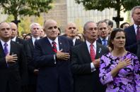 Former Mayor Rudy Giuliani (2nd L) and New York City Mayor Michael Bloomberg (2nd R) attend a ceremony at the 9/11 Memorial marking the 12th anniversary of the attacks on the World Trade Center in New York September 11, 2013. (REUTERS/David Handschuh)