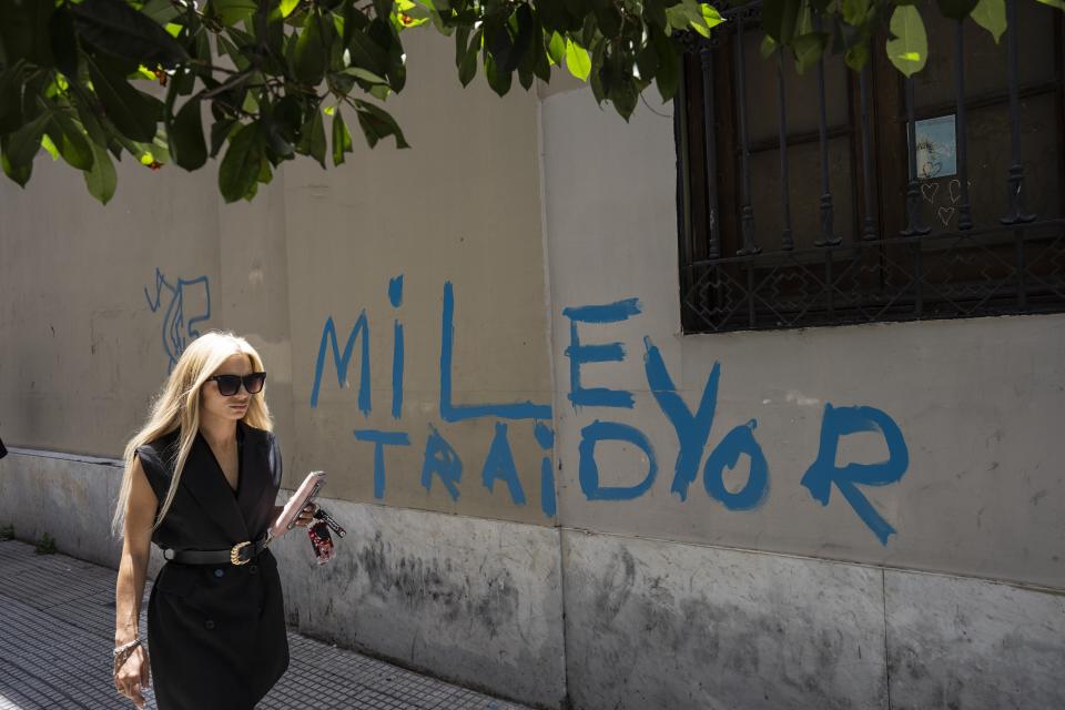 FILE - Graffiti that reads in Spanish: "Milei traitor" in Buenos Aires, Argentina, Dec. 21, 2023. Milei has drastically cut spending to end the fiscal deficit and contain inflation of almost 161% annually, including devaluing the peso more than 50%, dismissing public employees, suspending public works and reducing transportation and energy subsidies. (AP Photo/Rodrigo Abd, File)