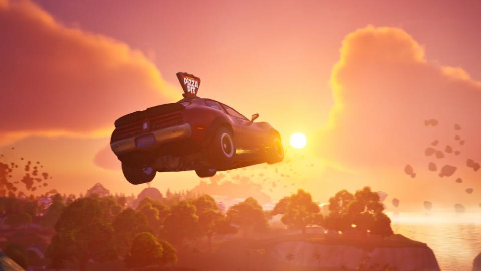 A pizza pit car jumps across a ravine during a picturesque sunrise