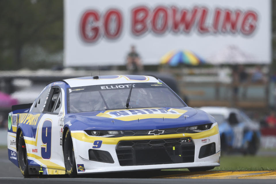 Chase Elliott drives through the bus stop during the NASCAR Cup Series auto race in Watkins Glen, N.Y., on Sunday, Aug. 8, 2021. (AP Photo/Joshua Bessex)