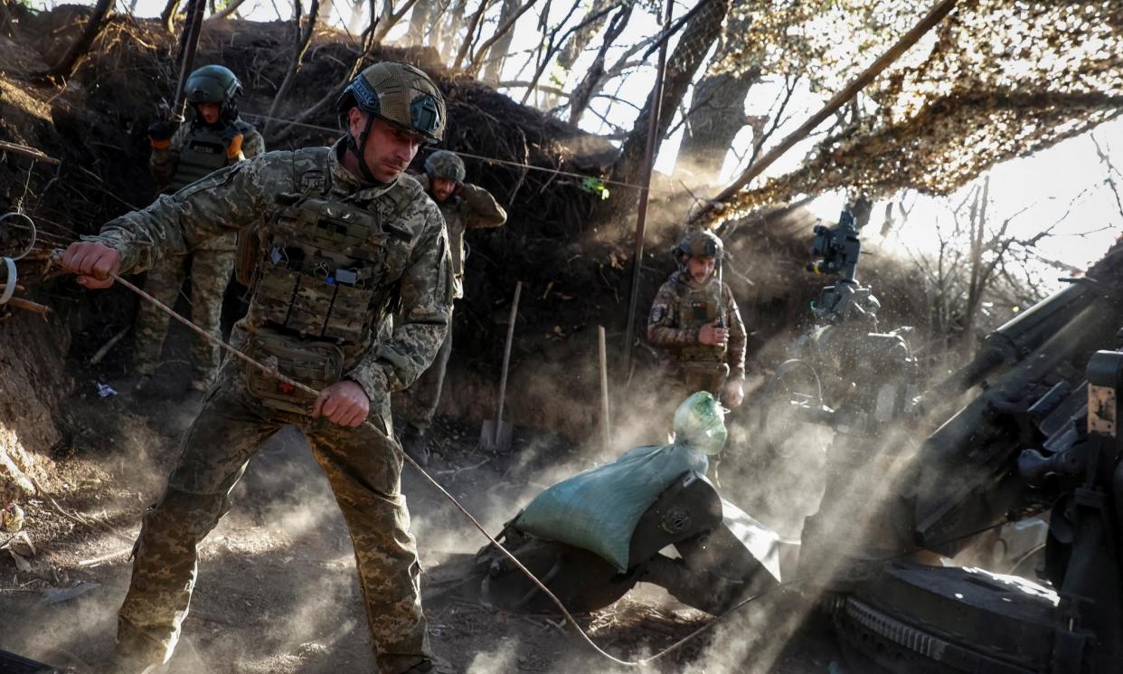 <span>Service personnel fire a howitzer towards Russian forces in the Donetsk region on Saturday.</span><span>Photograph: Serhii Nuzhnenko/Radio Free Europe/Radio Liberty/Reuters</span>