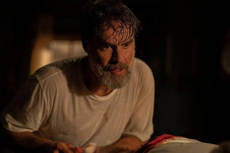 Frank (Murray Bartlett) attends to wounds in The Last of Us.