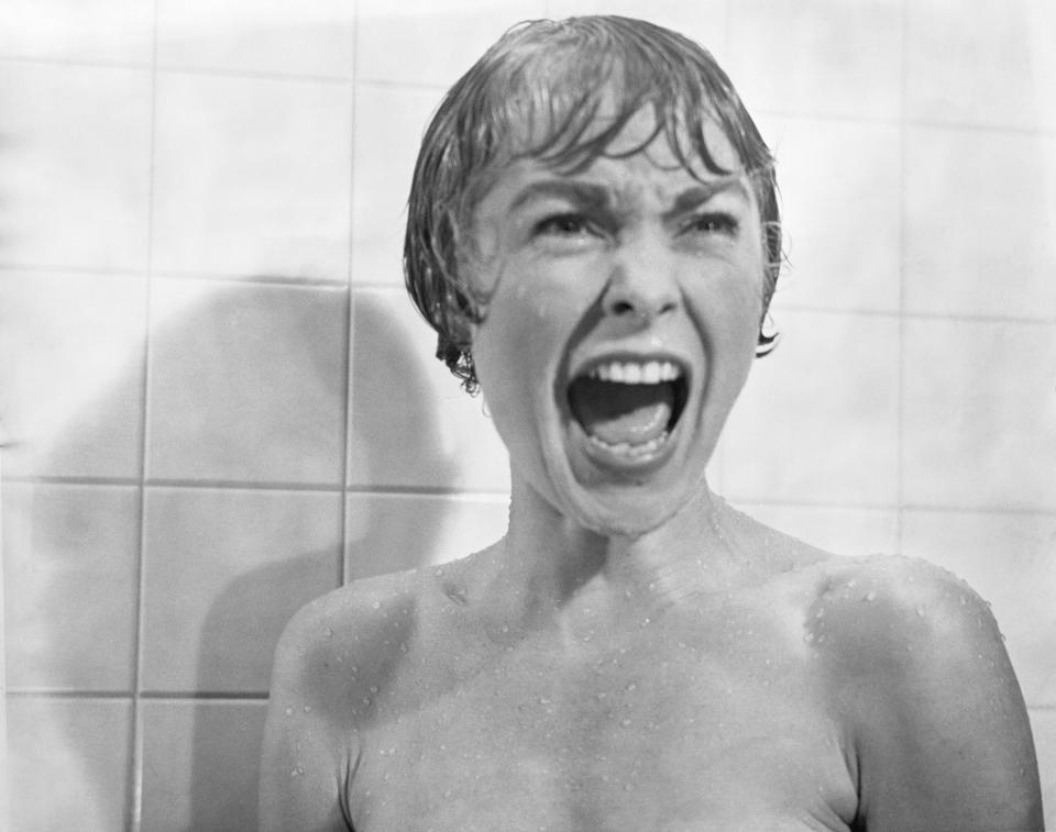 In the infamous shower scene from the film <em>Psycho</em>, Marion Crane (Janet Leigh) screams in terror as Norman Bates tears open her shower curtain.<span class="copyright">Bettmann/Getty Images</span>