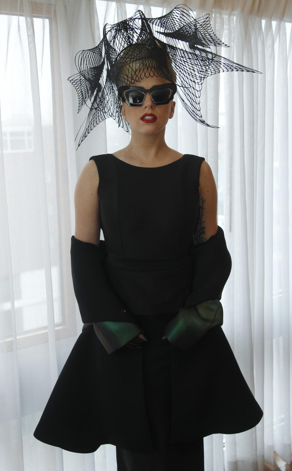 FILE - In this Feb. 29, 2012 file photo, performer Lady Gaga poses for a portrait in her hotel suite prior to an event launching her "Born this Way" foundation at Harvard University in Cambridge, Mass. Lady Gaga has said she’s performed electronic music for years and struggled early in her career because the sound wasn’t popular. She had her breakthrough in 2008 with various electronic-tinged hits, from “Poker Face” to “Just Dance.” (AP Photo/Charles Krupa, file)