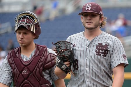 Jun 19, 2018; Omaha, NE, USA; Mississippi State Bulldogs starting pitcher Konnor Pilkington (48) and catcher Dustin Skelton (8) walk to the dugout after warming up before the game against the North Carolina Tar Heels in the College World Series at TD Ameritrade Park. Mandatory Credit: Steven Branscombe-USA TODAY Sports