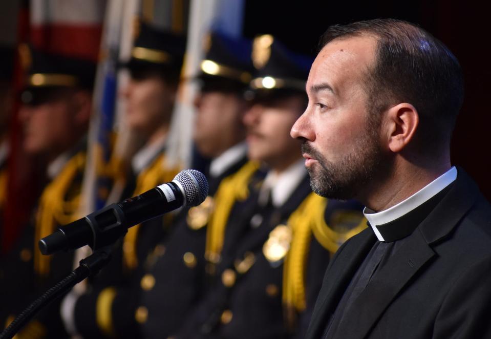 The Rev. Jay Mello, chaplain of the Fall River Police Department, gives the benediction at Fall River's inauguration of municipal officers Tuesday, Jan. 3, 2024 at B.M.C. Durfee High School in Fall River.