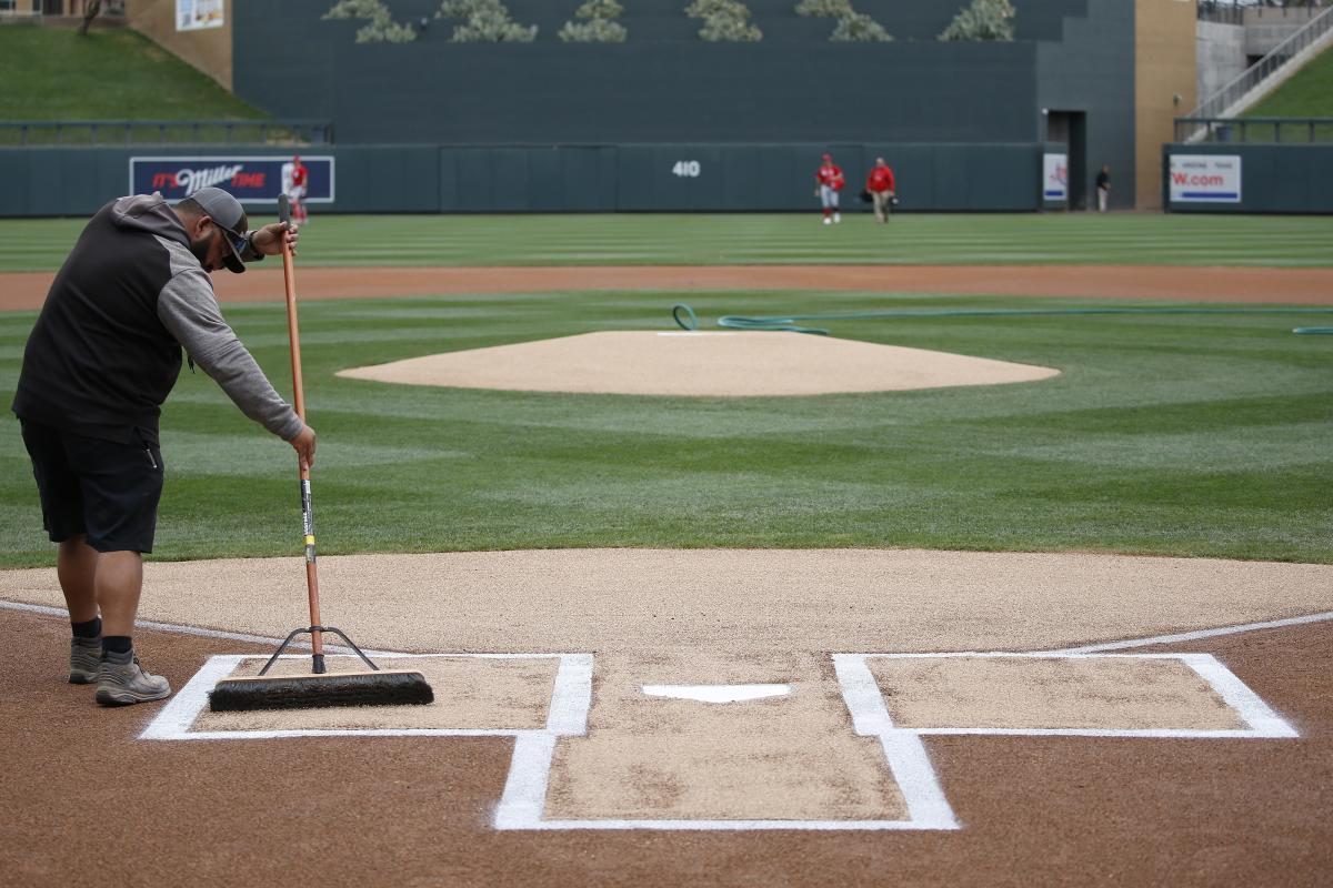 Washington Nationals' Max Scherzer and his wife Erica, second from right,  holding their daughter Brooklyn, stand on the field before a baseball game  against the Arizona Diamondbacks, Sunday, June 16, 2019, in