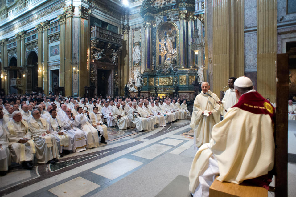 In this photo provided by the Vatican paper L'Osservatore Romano, Pope Francis listens as Jesuit leader Rev. Adolfo Nicolas, second from right, delivers his message during a mass he celebrated with the Jesuits on the occasion of the order's titular feast, in Rome's Jesus' Church, Friday, Jan. 3, 2014. (AP Photo/Osservatore Romano, ho)