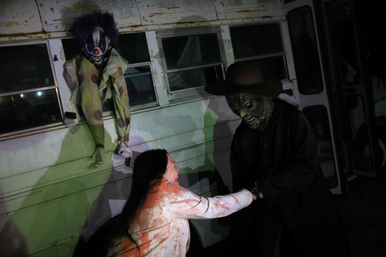 Katie Conner fights with Royce Radcliffe as "Jeepers Creepers" during a performance scene prior to Halloween at R & P Haunted Farm in Woodlawn, Tennessee on Wednesday, oct. 18, 2023.