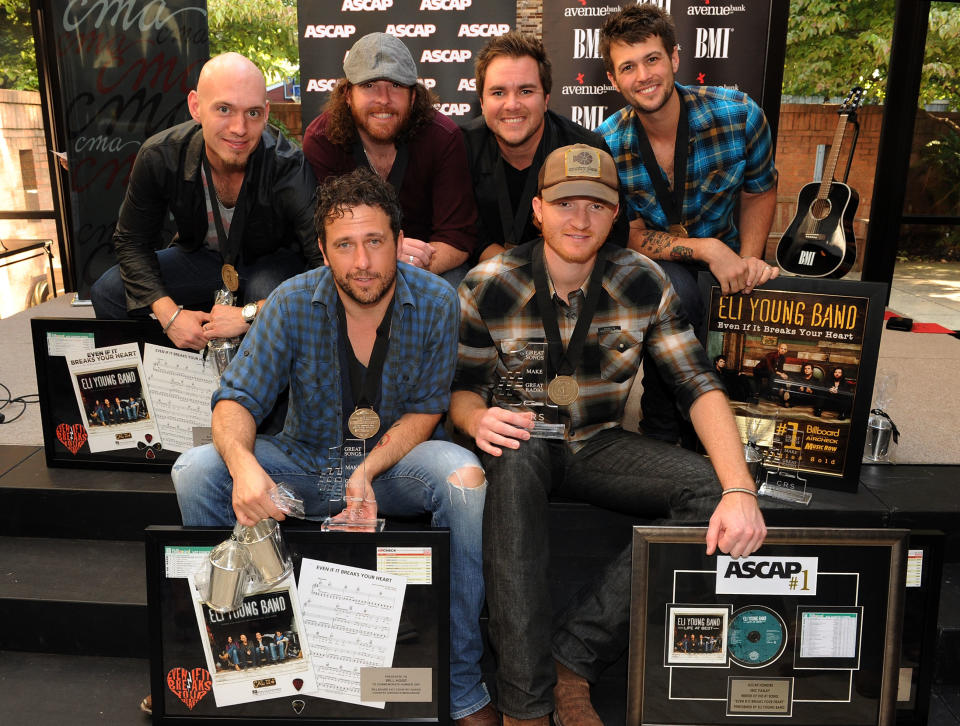 Eli Young Band -- Vocal Group of the Year Nomination <p><br> Front Row: Songwriter Will Hoge (BMI) and Songwriter Eric Paslay (ASCAP) are honored for there #1 hit "Even if it breaks your heart" recorded by Republic Nashville recording artists Eli Young Band: Jon Jones, James Young, Mike Eli and Chris Thompson at the CMA offices on August 20, 2012 in Nashville, Tennessee. (Photo by Rick Diamond/Getty Images for BMI)</p>