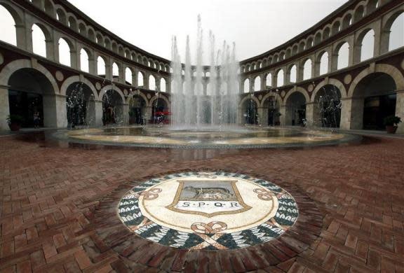 An emblem decorates the pavement next to a fountain inside a building that looks like a Roman Coliseum at the Florentia Village in the district of Wuqing, located on the outskirts of the city of Tianjin June 13, 2012. <br><br><a href="http://news.yahoo.com/photos/china-replicates-austrian-village-slideshow/" data-ylk="slk:Click here;elm:context_link;itc:0;sec:content-canvas;outcm:mb_qualified_link;_E:mb_qualified_link;ct:story;" class="link  yahoo-link">Click here</a> to see a related gallery: China replicates Austrian village