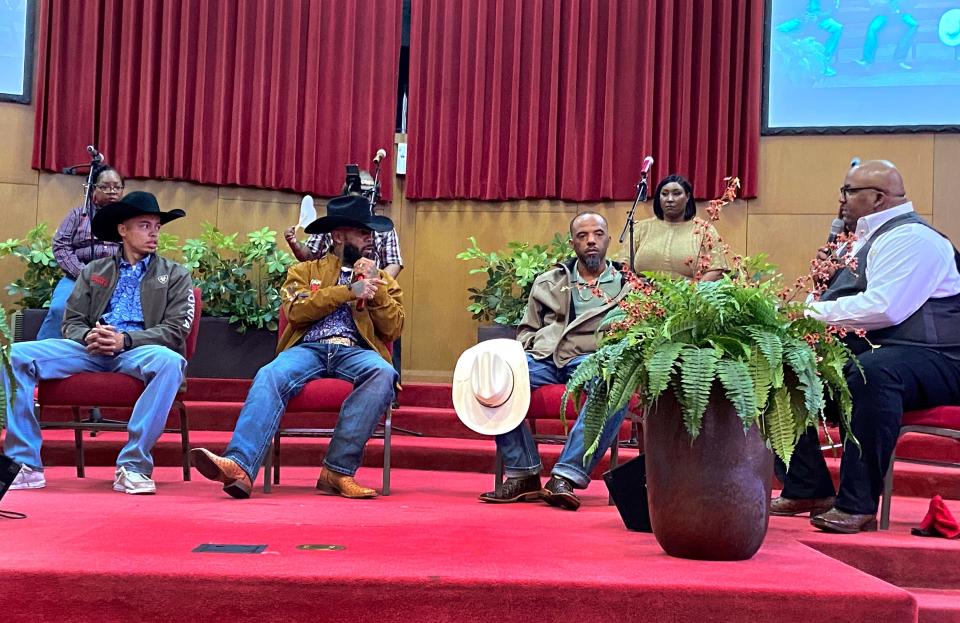 The Rev. A. Byron Coleman talks with rodeo cowboys Lamarr Hankins, Damon Hopkins Sr. and Marcus Verser during the trio's visit on "Western Day" at Fifth Street Baptist Church, 801 NE 5.