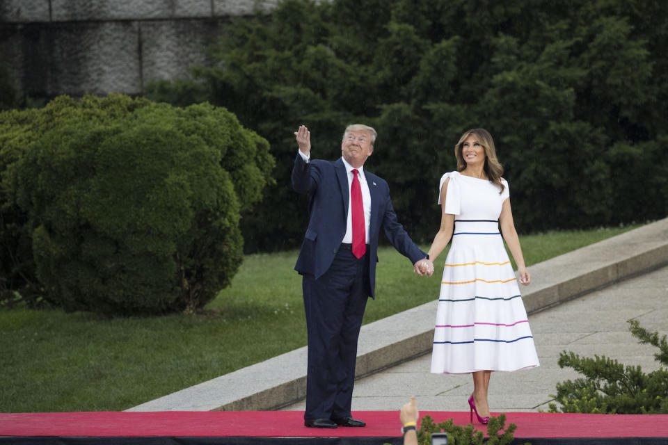 In celebration of Pride Month on July 4, the First Lady stepped out in a rainbow-emblazoned frock by Carolina Herrera - which now on sale for £1,074. A pair of hot pink Christian Louboutin pumps completed the bold look. [Photo: Getty]