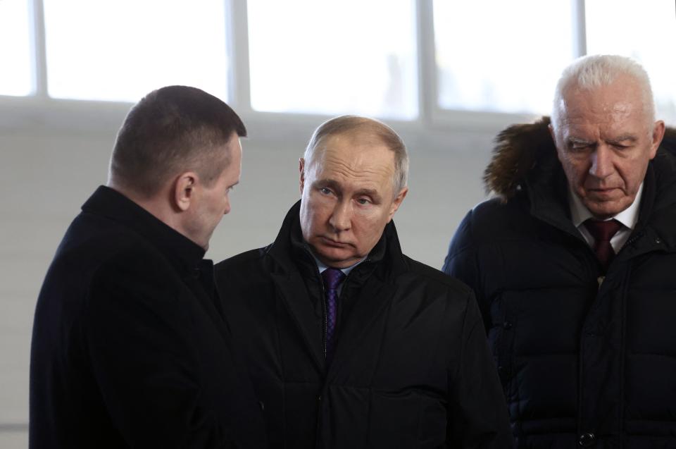 Russian President Vladimir Putin (C) visits the Ustianskiy timber complex in the northern Arkhangelsk region on February 10, 2023. (Photo by Alexander RYUMIN / SPUTNIK / AFP) (Photo by ALEXANDER RYUMIN/SPUTNIK/AFP via Getty Images)
