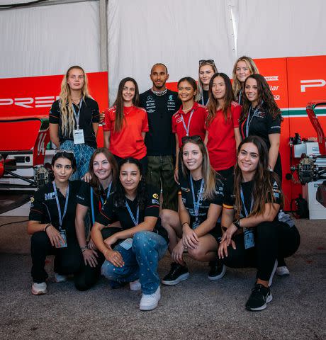 <p>F1 Academy</p> Lewis Hamilton wit the Women of F1 Academy