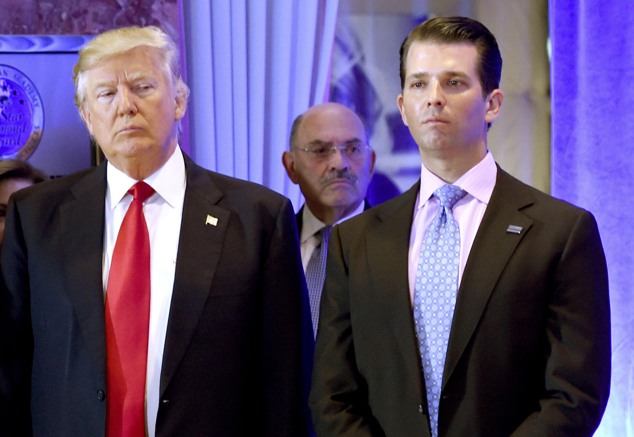 Donald Trump, Allen Weisselberg and Donald Trump Jr. arrive for a press conference at Trump Tower in New York. (Photo by Timothy A. Clary/AFP/Getty Images/File)