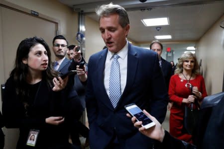 FILE PHOTO: Sen. Jeff Flake speaks with reporters on Capitol Hill in Washington, U.S., December 6, 2017. REUTERS/Aaron P. Bernstein