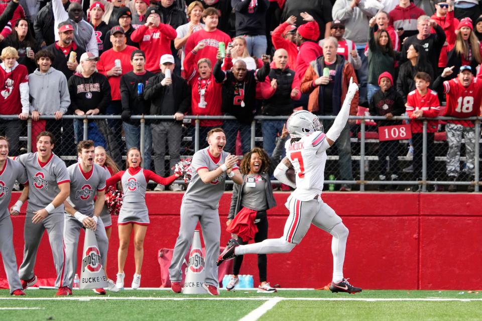 Ohio State cornerback Jordan Hancock returns an interception for a touchdown against Rutgers.