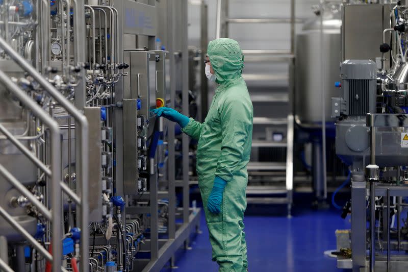 FILE PHOTO: A technician works at a manufacturing facility of Chinese vaccine maker CanSino Biologics in Tianjin, China