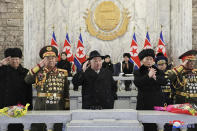 In this photo provided by the North Korean government, North Korean leader Kim Jong Un, center, with his daughter, rear center, and his wife Ri Sol Ju, rear left, attend a military parade to mark the 75th founding anniversary of the Korean People’s Army on Kim Il Sung Square in Pyongyang, North Korea Wednesday, Feb. 8, 2023. Independent journalists were not given access to cover the event depicted in this image distributed by the North Korean government. The content of this image is as provided and cannot be independently verified. Korean language watermark on image as provided by source reads: "KCNA" which is the abbreviation for Korean Central News Agency. (Korean Central News Agency/Korea News Service via AP)