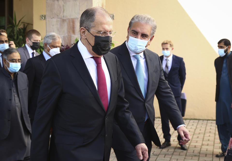 In this photo released by Russian Foreign Ministry Press Service, Russian Foreign Minister Sergey Lavrov, left, and Pakistan's Foreign Minister Shah Mahmood Qureshi walk during their meeting in Islamabad, Pakistan, Wednesday, April 7, 2021. (Russian Foreign Ministry Press Service via AP)