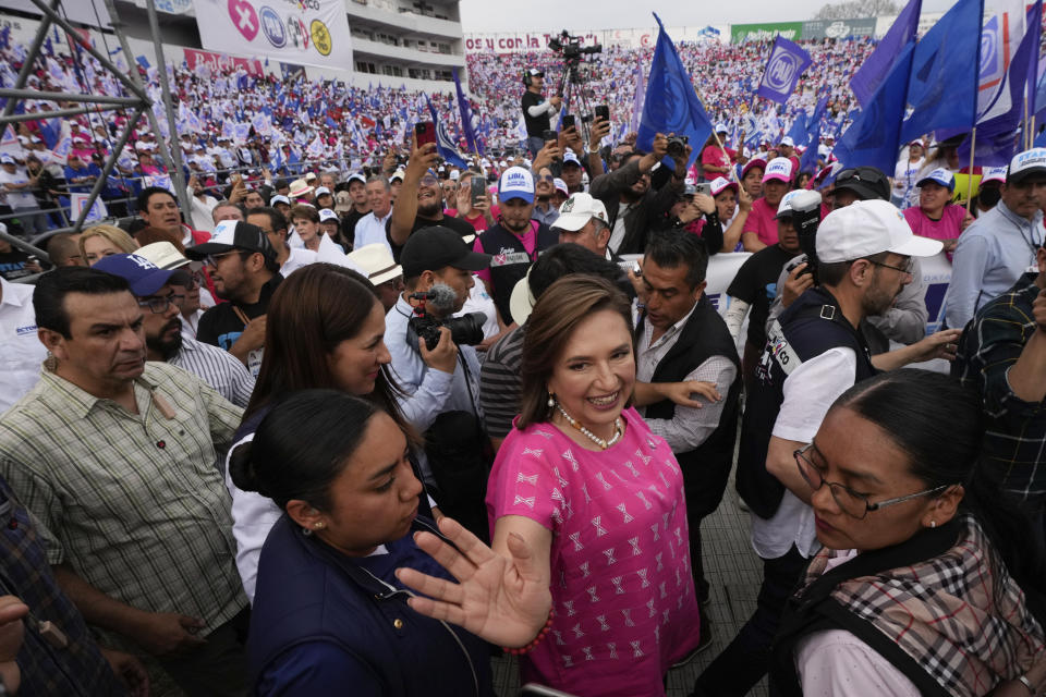 FILE - Opposition presidential candidate Xóchitl Gálvez waves as she arrives for her opening campaign rally in Irapuato, Mexico, March 1, 2024. Mexican voters will go to the polls in the largest elections in the country’s history on June 2, 2024. In the presidential race, they will have to choose between three candidates, but two women have taken the lead: Gálvez and ruling party candidate Claudia Sheinbaum. (AP Photo/Fernando Llano, File)